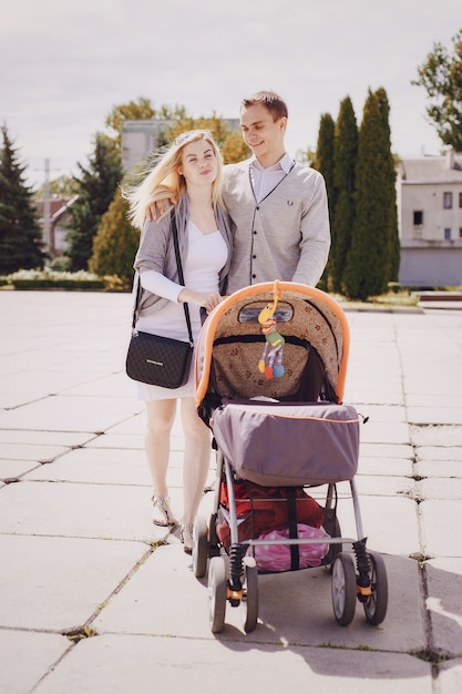 Parents strolling a baby stroller