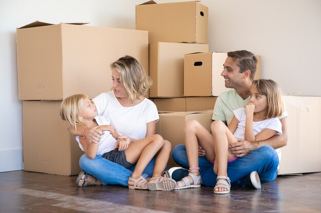 Parents talking with daughter on mother hands