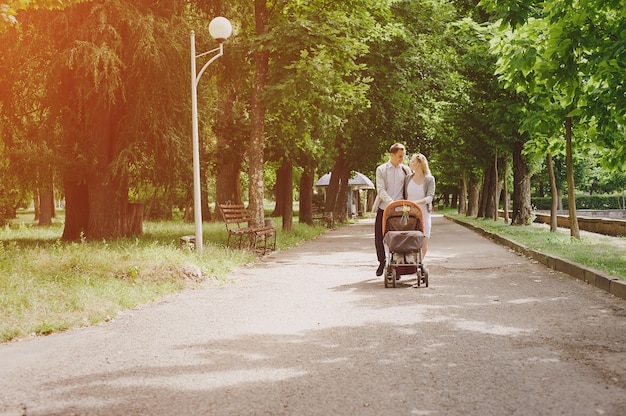 Parents walking their baby in a stroller