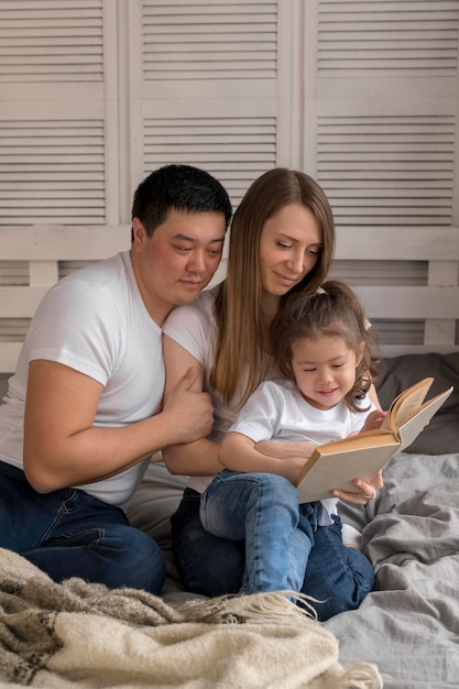 Parents with girl reading