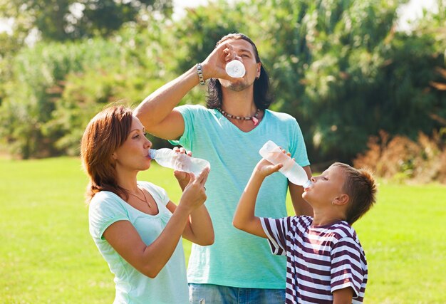parents with teenager drinking water