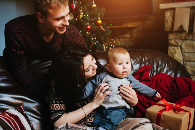 Parents with their baby on the couch