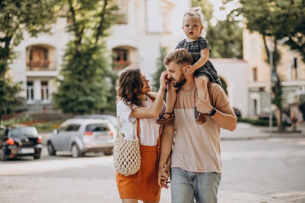 Parents with their little daughter in town