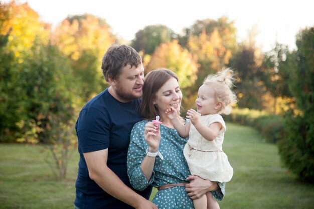 Parents with tot girl in park