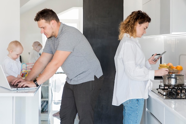 Parents working indoors