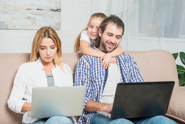 Parents working with laptops