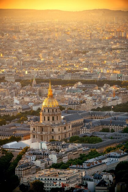 Paris city rooftop view with Napoleon's tomb at sunset.