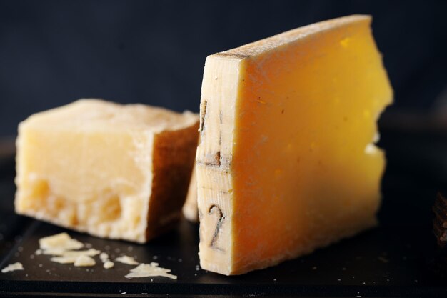 Parmesan cheese on wooden board