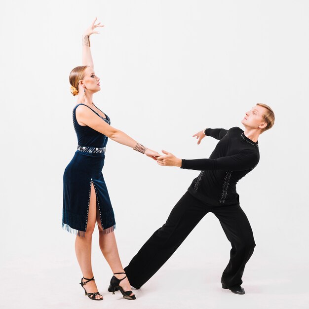 Partners dancing on white background