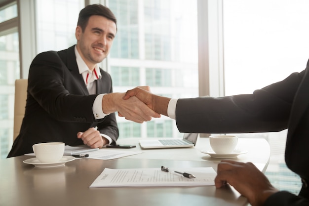 Free photo partners shaking hands after singing contract