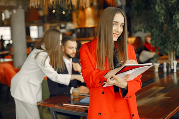 Partners sitting at the table and working in a cafe