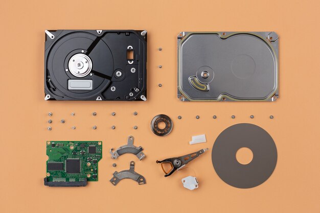 Parts of a hard disk belonging to computer hardware, exploded one by one and arranged