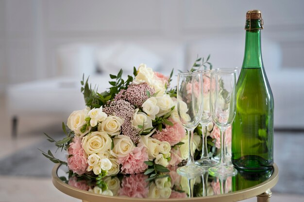 Party arrangement with flowers and bottle