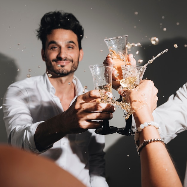 Free photo party boy posing with champagne