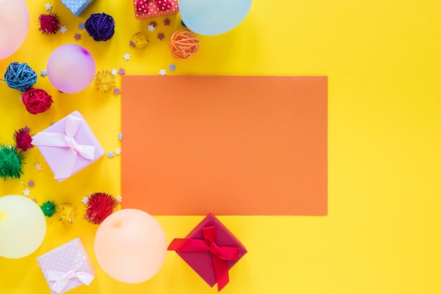 Free photo party colorful balloons on yellow background