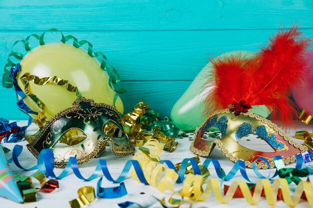 Party decoration material with masquerade carnival feather mask and balloons