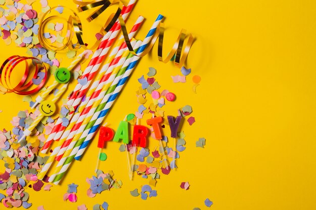 Party decoration with the word "party" on a yellow table