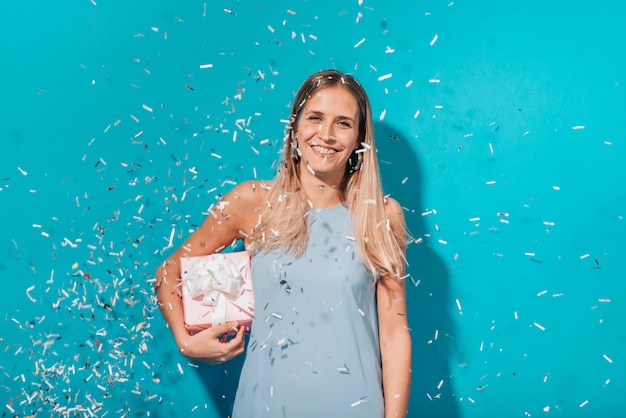 Party girl posing with confetti