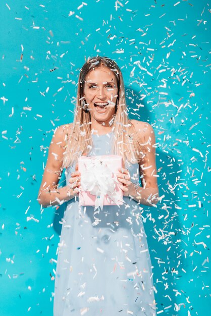 Party girl posing with confetti