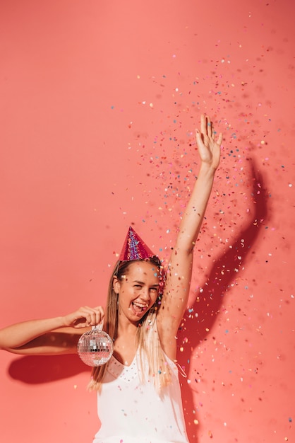 Party girl posing with confetti