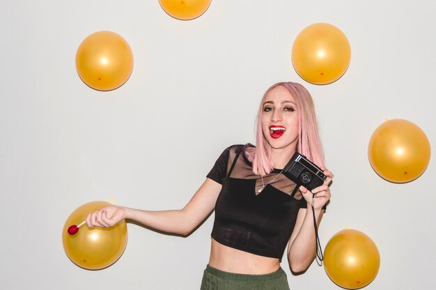 Free photo party girl with lollipop having fun