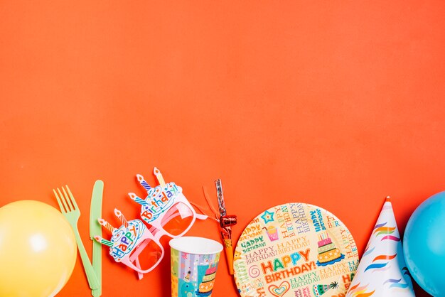 Party supplies on orange background