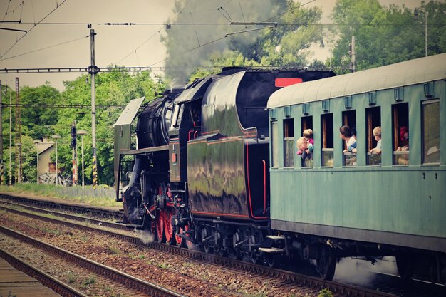 "Passengers in steam train"