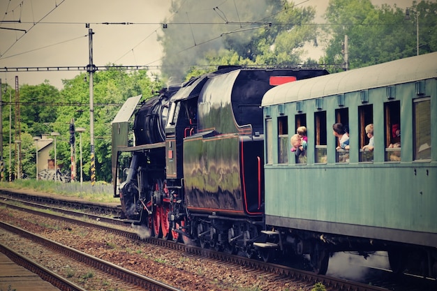 "Passengers in steam train"