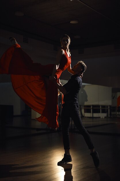 Passion dance couple, woman jumping