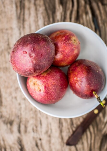 Passion fruit on a wooden board with knife