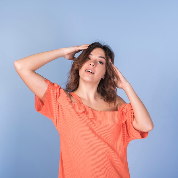 Free photo passionate woman in blouse holding head