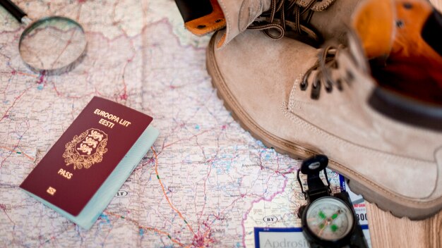 Passport and boots on map