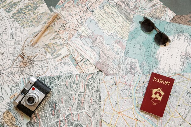 Passport and camera on maps