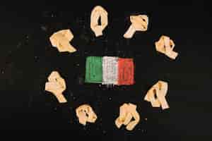 Free photo pasta around italian flag