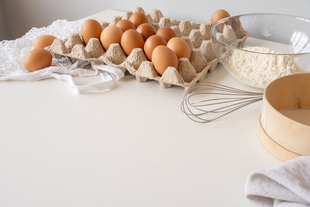 Pasta ingredients on table with copy-space