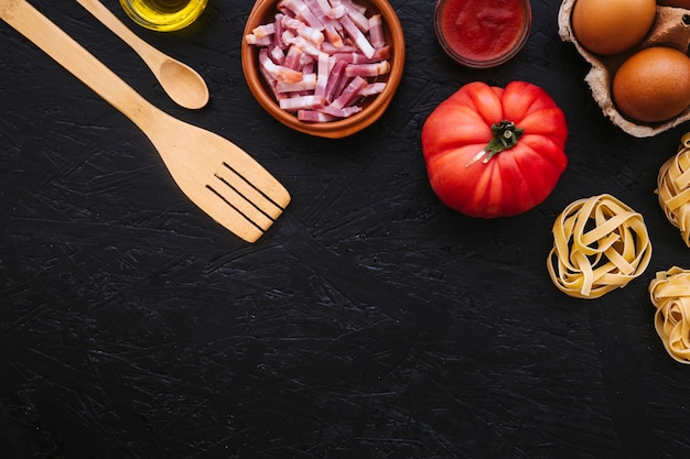 Pasta near utensils and ingredients