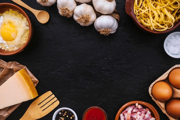 Pasta near utensils and ingredients