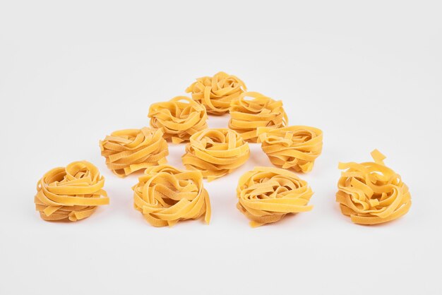 Pasta rolls on kitchen towel.