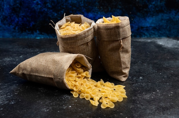 Pasta varieties inside rustic baskets.