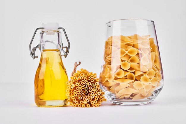 Pasta with a bottle of oil.