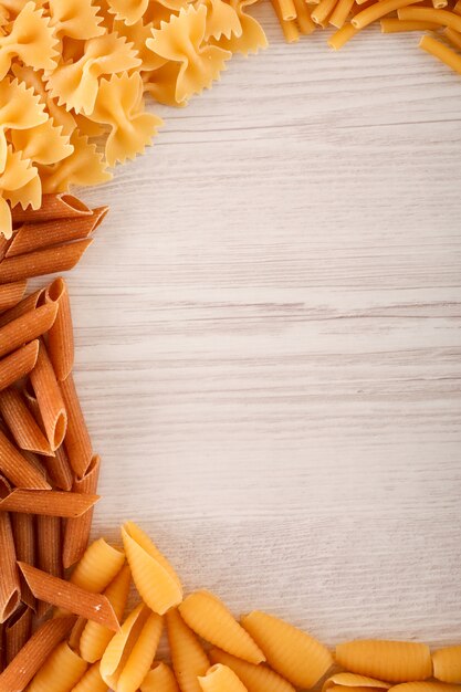 pasta with copy space on white wooden surface