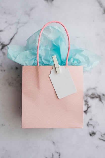 Pastel color gift bag on marble