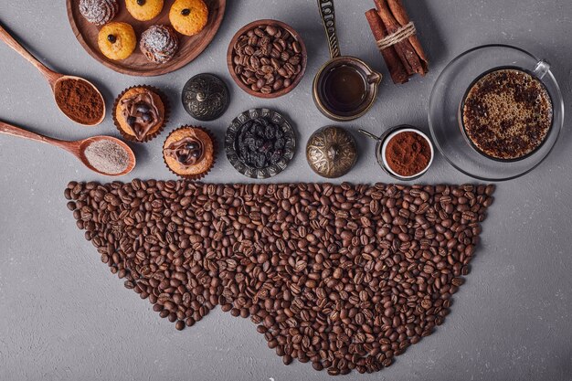 Pastries and coffee on grey surface.