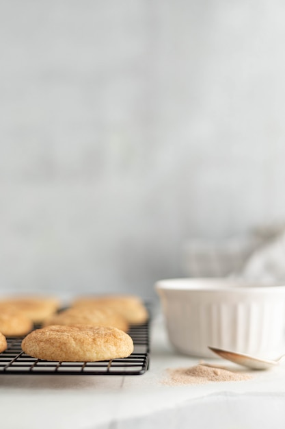 Free photo pastries on tray near white ceramic bowl