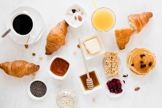 Pastries with jam honey and coffee