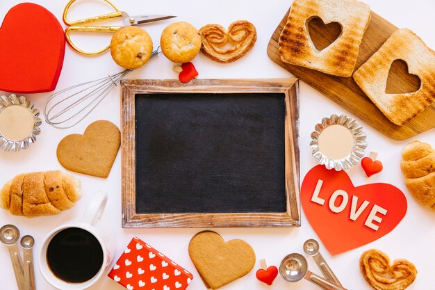 Pastry around empty chalkboard