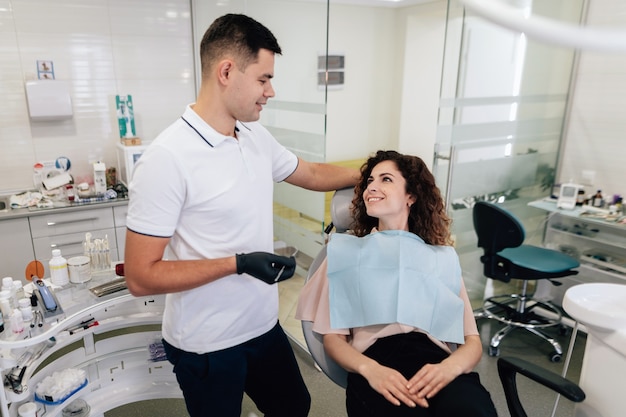 Patient and dentist smiling at each other