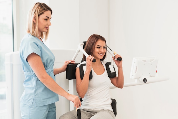 Patient doing medical exercises  supervised by doctor