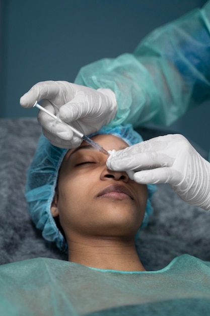 Patient getting anesthesia high angle