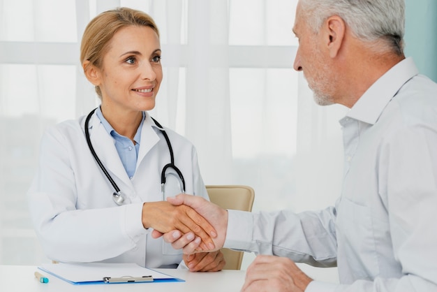 Patient holding doctor hand